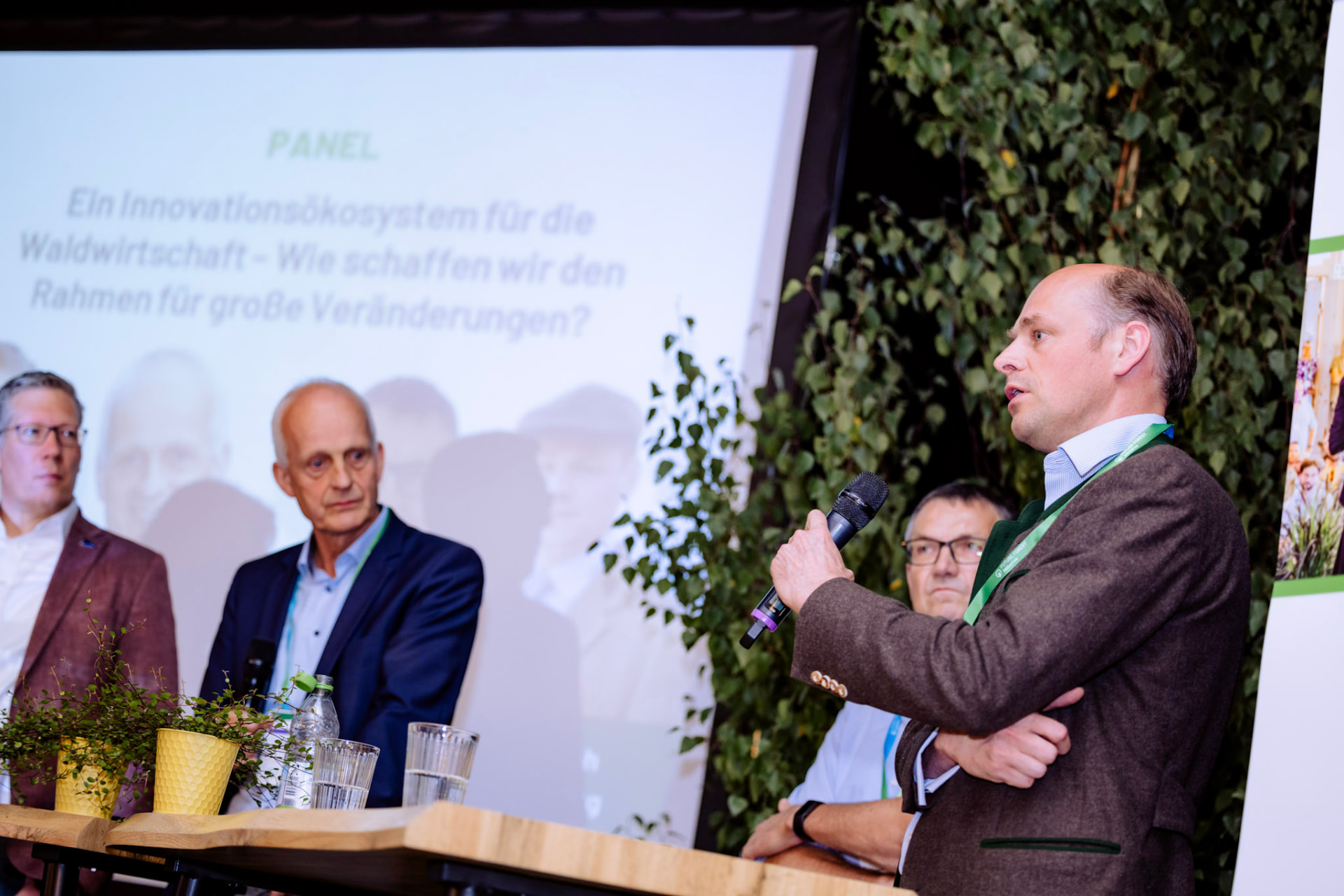 Christoph Prinz zu Stolberg speaking with a microphone on a forestry panel